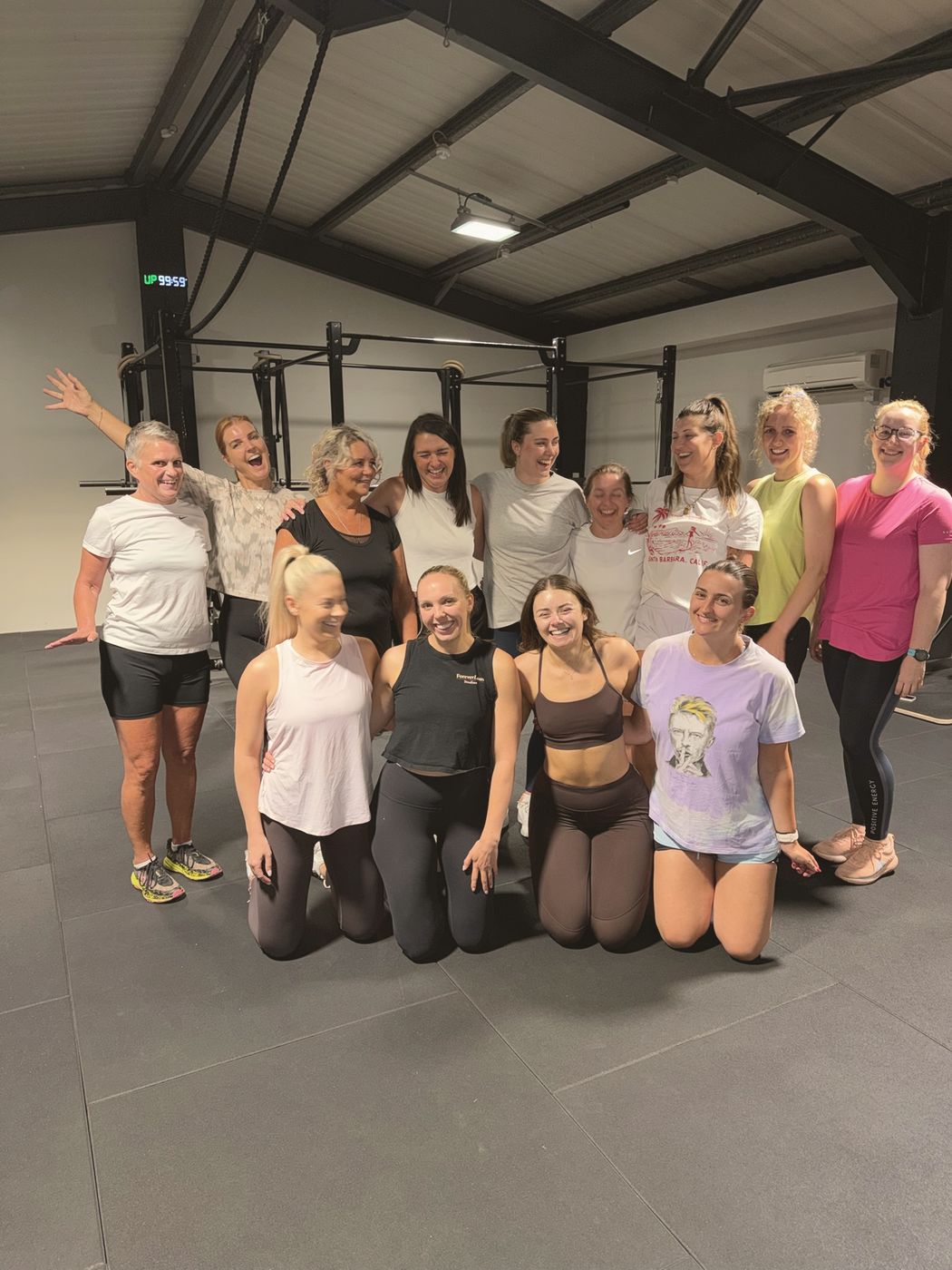 Members smiling and waving after a session