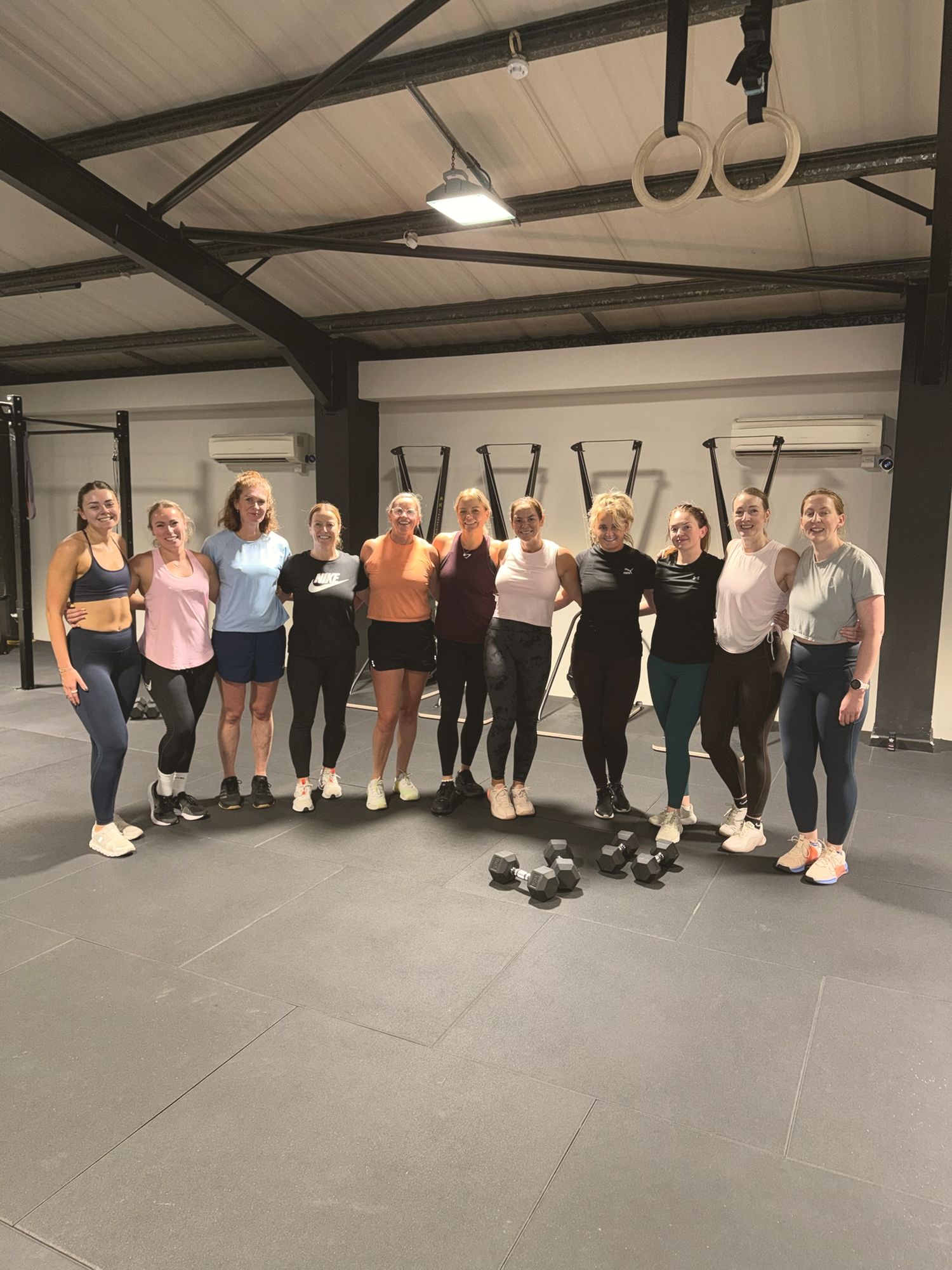 A group of members standing together on the studio floor